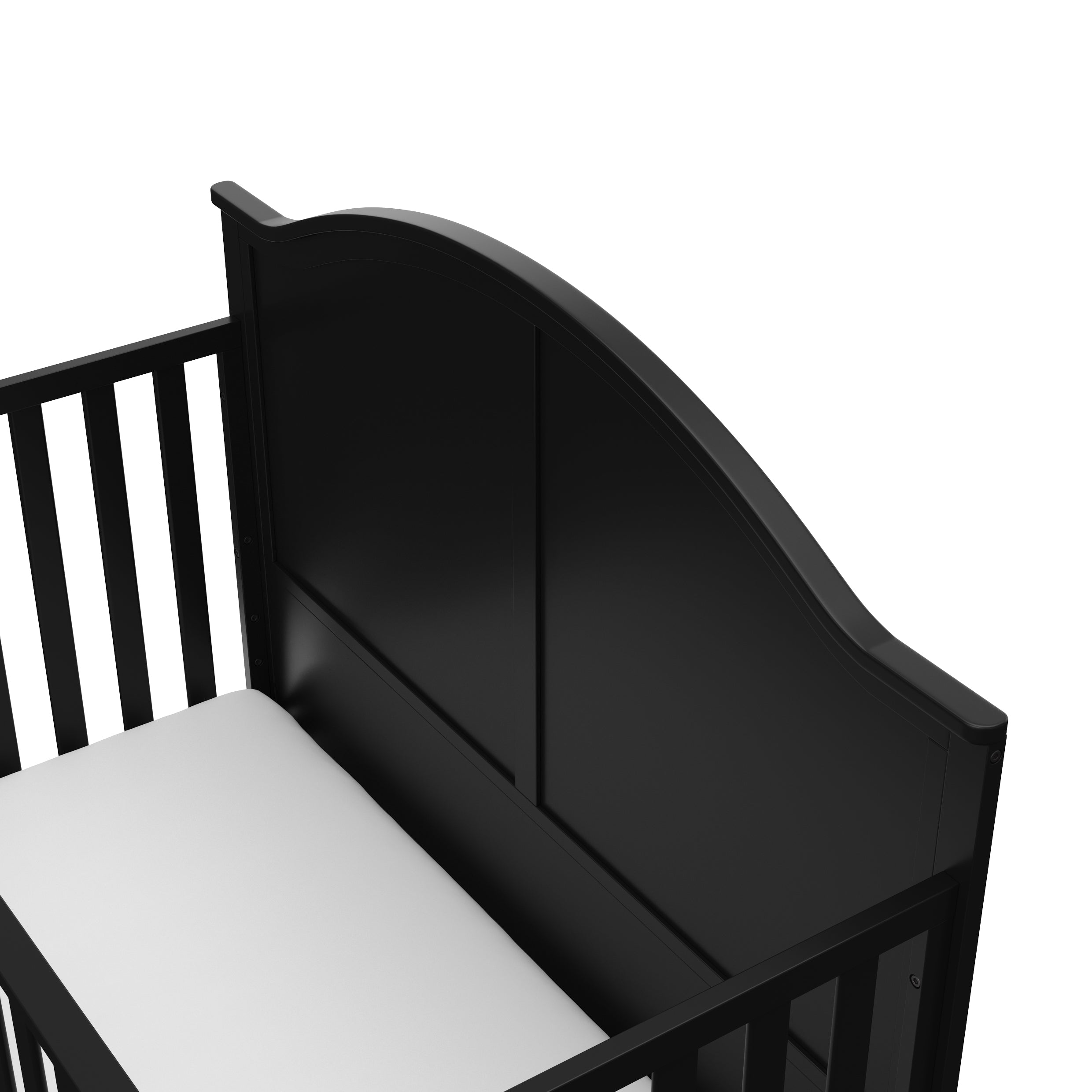 Close-up view of black crib's headboard