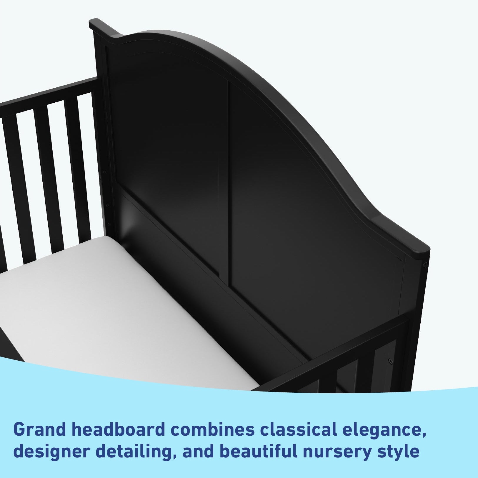 Close-up view of black crib's headboard graphic