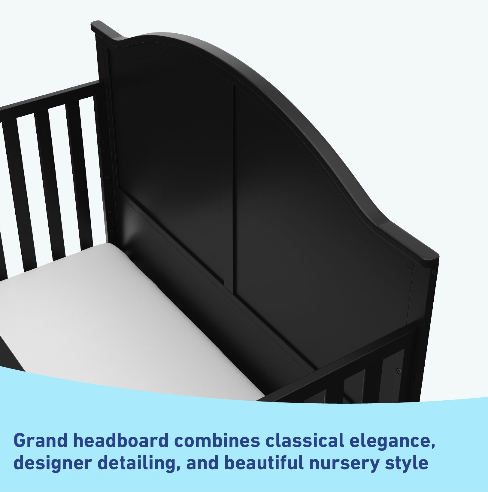 Close-up view of black crib's headboard graphic