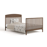 Benton hazelnut crib with drawer converted to full-size bed with footboard
