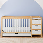 Remi natural with white crib and changer in a nursery