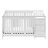 Front view of White crib and changer