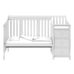 White crib and changer in toddler bed conversion