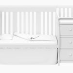 White crib and changer in toddler bed conversion