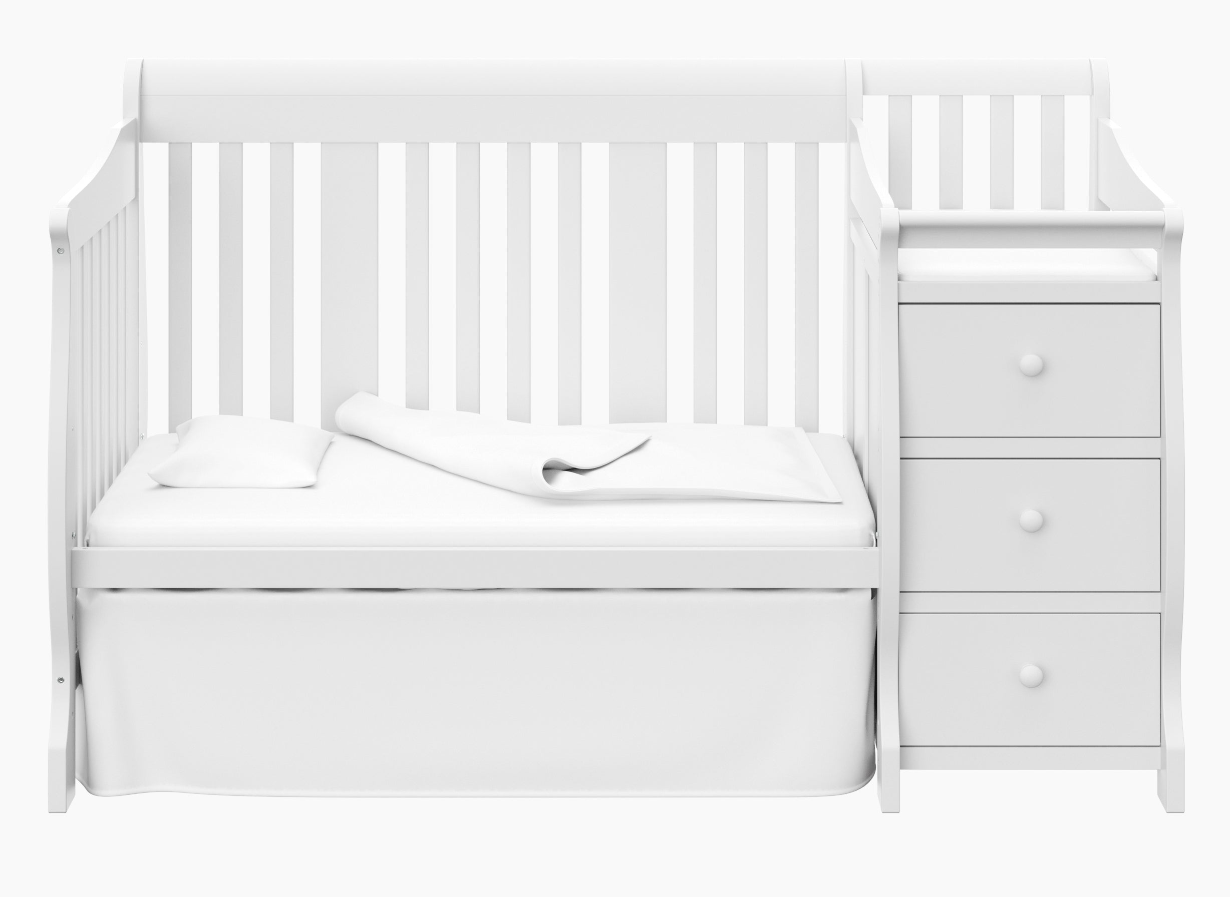 White crib and changer in toddler bed conversion