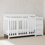 White crib and changer in nursery