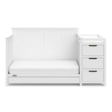 White crib and changer with drawer in toddler bed conversion