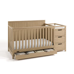 Hadley driftwood crib and changer with drawer open and bedding inside