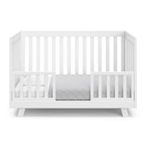 Beckett white crib converted to toddler bed with two guardrails