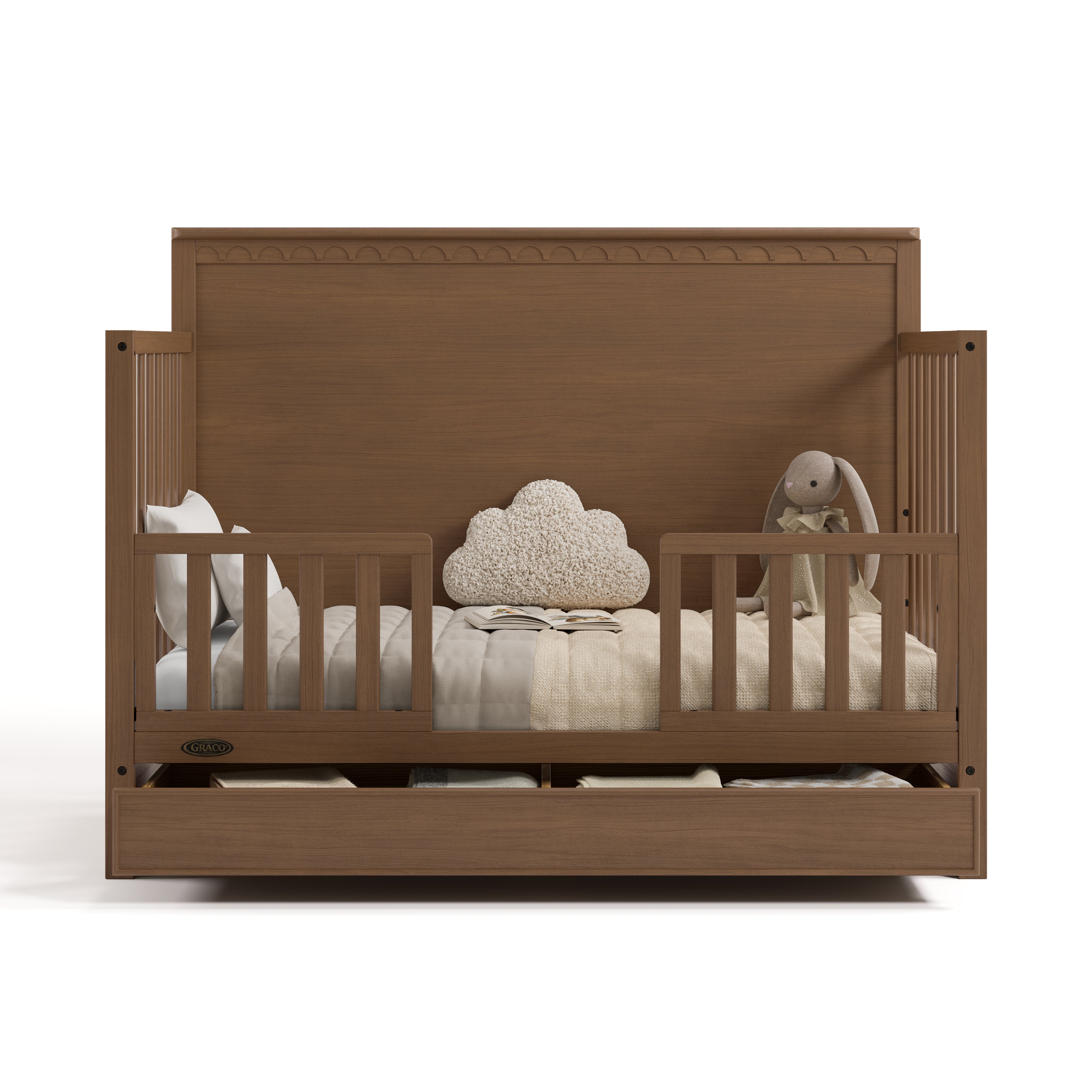 Sasha hazelnut crib with drawer converted to toddler bed with two guardrails