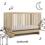 Santorini driftwood crib with black cartoon drawings