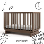 Santorini hazelnut crib with black cartoon drawings