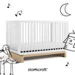 Santorini white with driftwood crib with black cartoon drawings