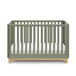 Front view of an olive crib with a natural wood color base
