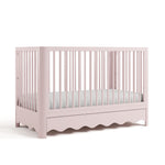 Casablanca blush crib with drawer angle view
