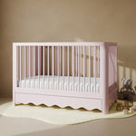 Casablanca blush crib with drawer in a nursery