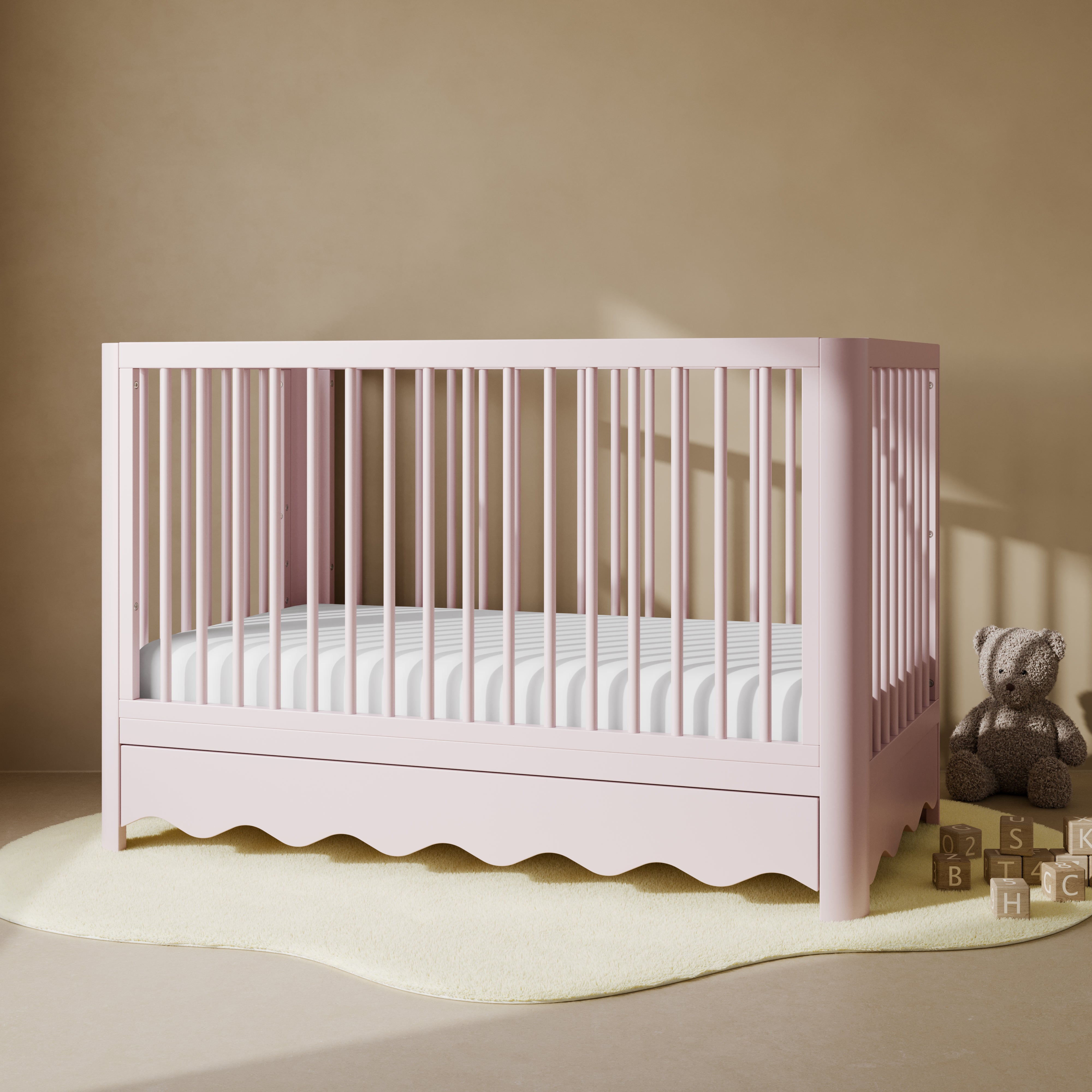 Casablanca blush crib with drawer in a nursery