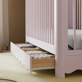 Casablanca blush crib close up of drawer in a nursery