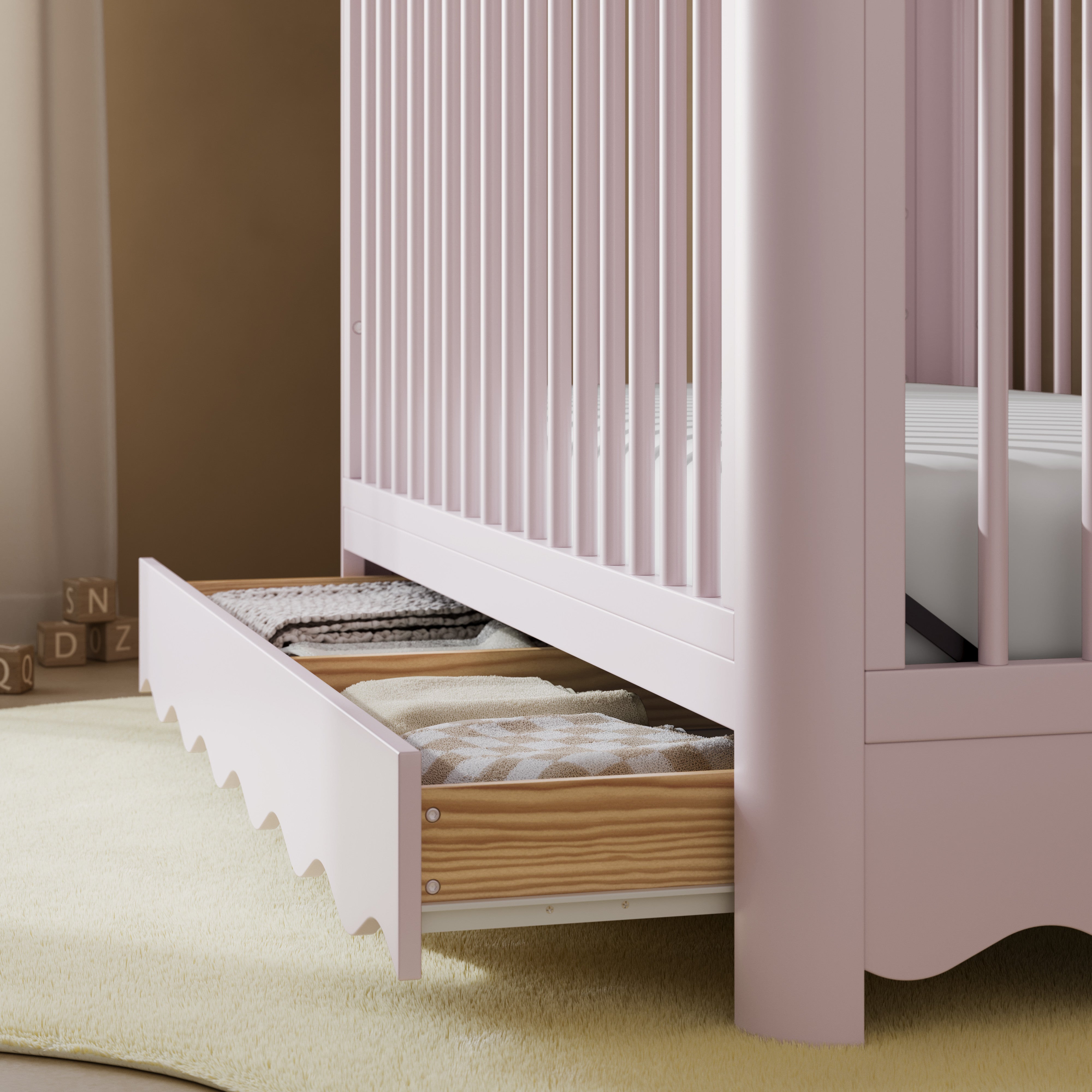 Casablanca blush crib close up of drawer in a nursery