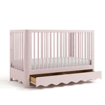 Casablanca blush crib with drawer open angle view
