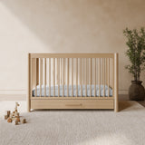 Malta driftwood crib with drawer in a nursery