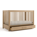 Malta driftwood crib with drawer open angle view