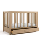 Malta driftwood crib with drawer open angle view