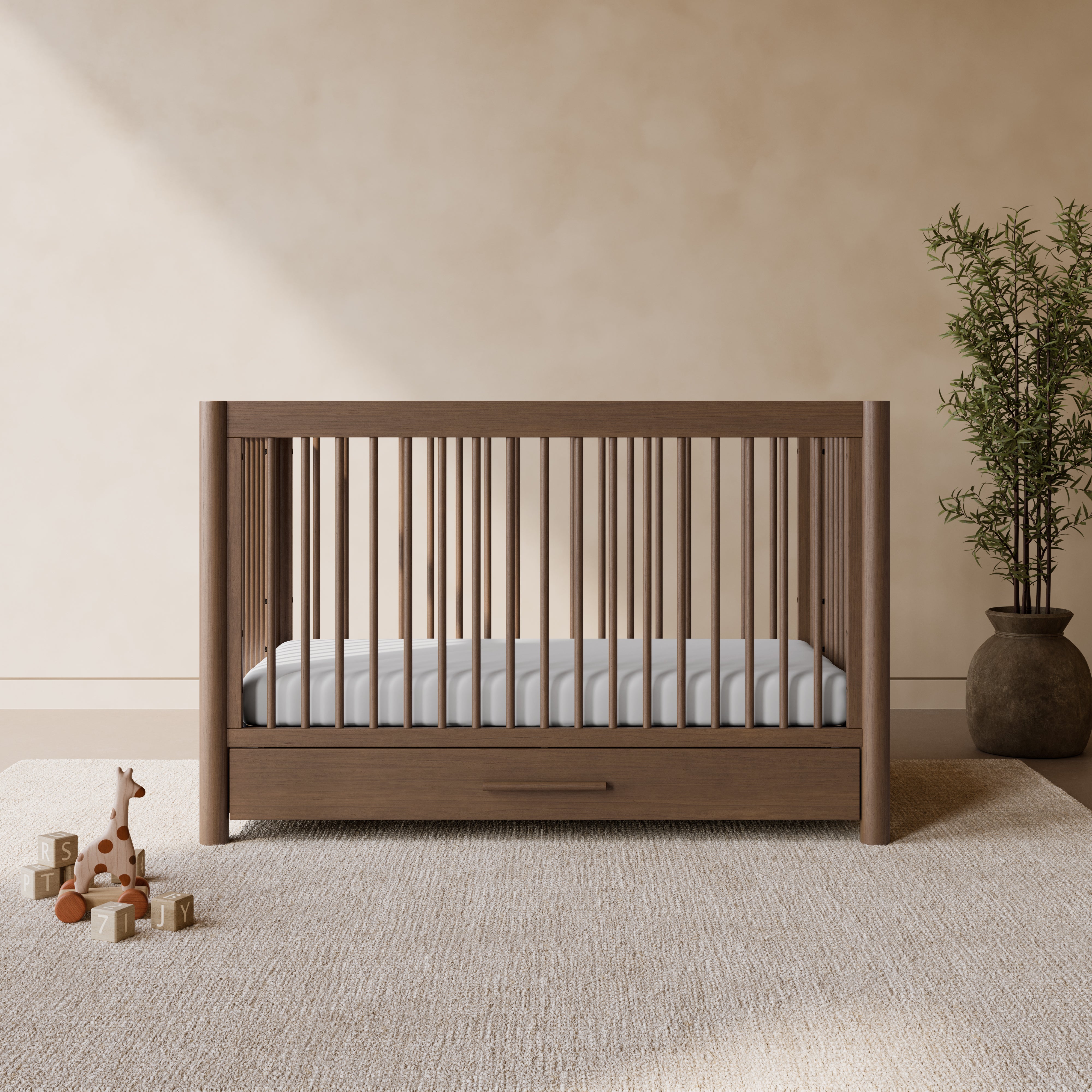 Malta hazelnut crib with drawer in a nursery