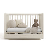 Malta frosted oat crib with drawer converted to daybed