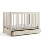 Malta frosted oat crib with drawer open angle view