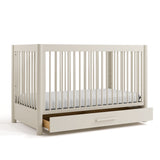 Malta frosted oat crib with drawer open angle view