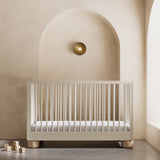 Sorrento frosted oat and driftwood crib in a nursery