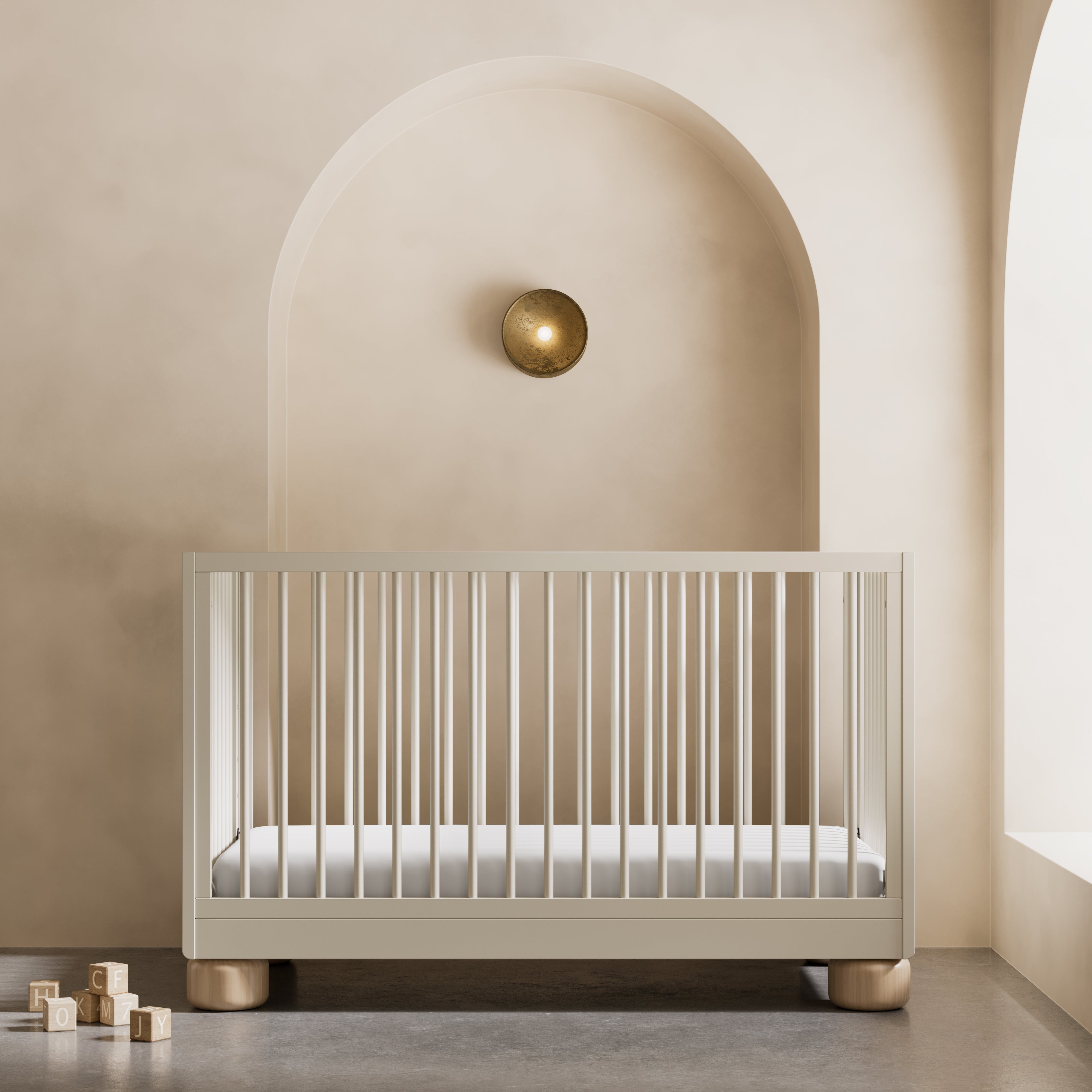 Sorrento frosted oat and driftwood crib in a nursery