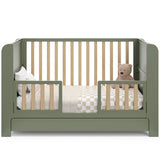 Read-with-me olive with driftwood crib converted to toddler bed with two guardrails