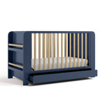 Read-with-me midnight blue with driftwood crib with drawer open angle view