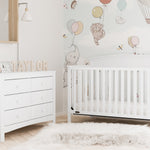 White 6 drawer dresser in nursery