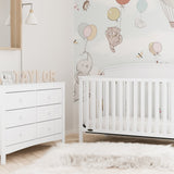 White 6 drawer dresser in nursery