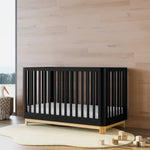 Santos black with natural crib in a nursery