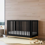Santos black with natural crib in a nursery