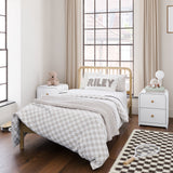 2 Santos white 2 drawer nightstands in kids bedroom with bed in middle