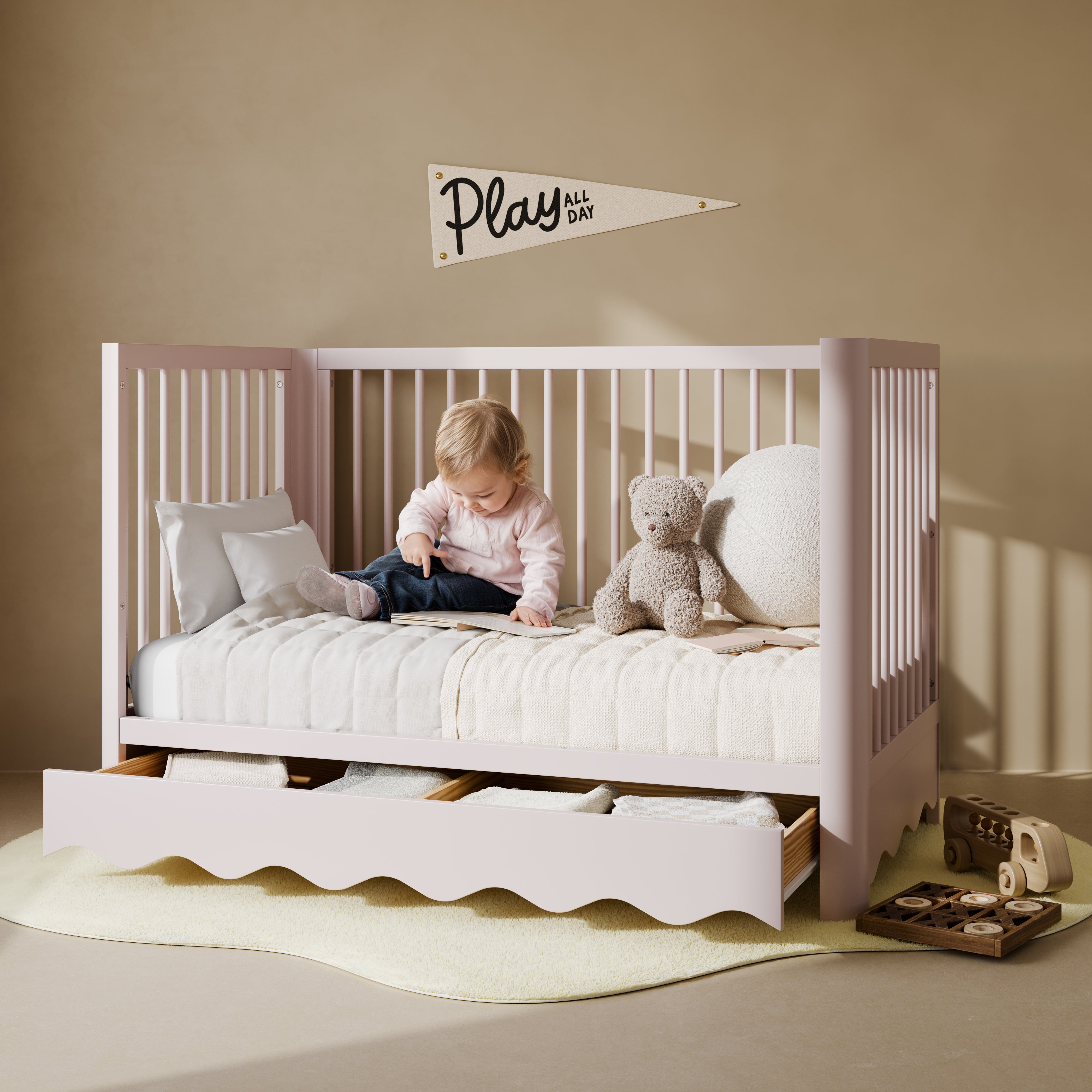 Casablanca blush crib converted to daybed in a nursery